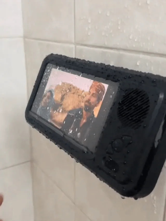 Real black shower phone case mounted on tile with video playing behind its front window