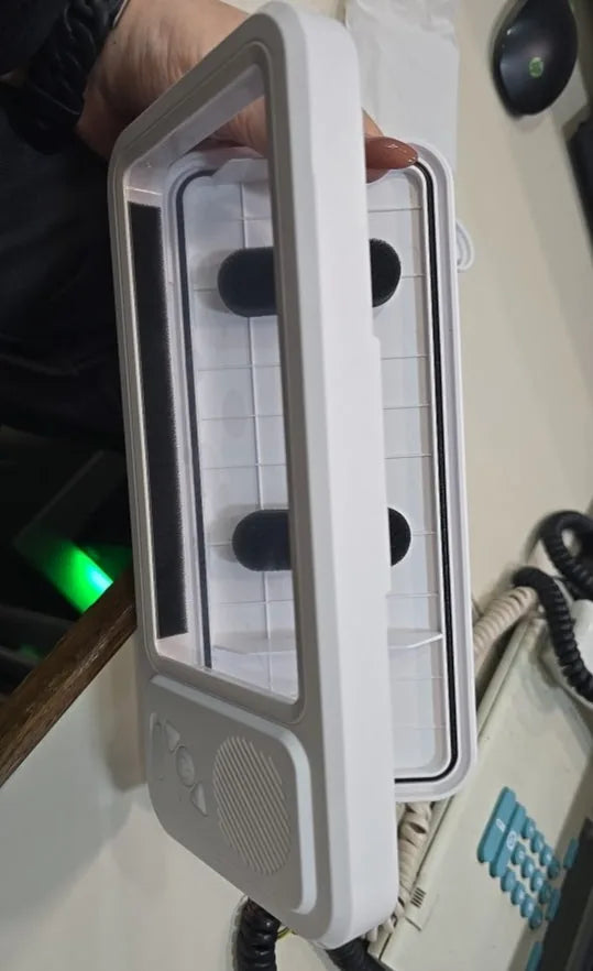 Genuine shower phone case open to show its interior, seal and protective spacers